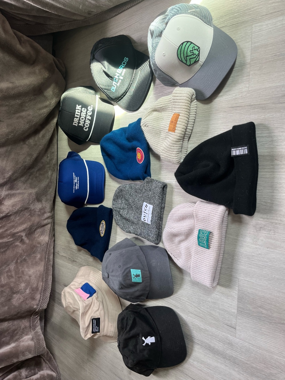 Assorted Dutch Bro’s beanies and hats
